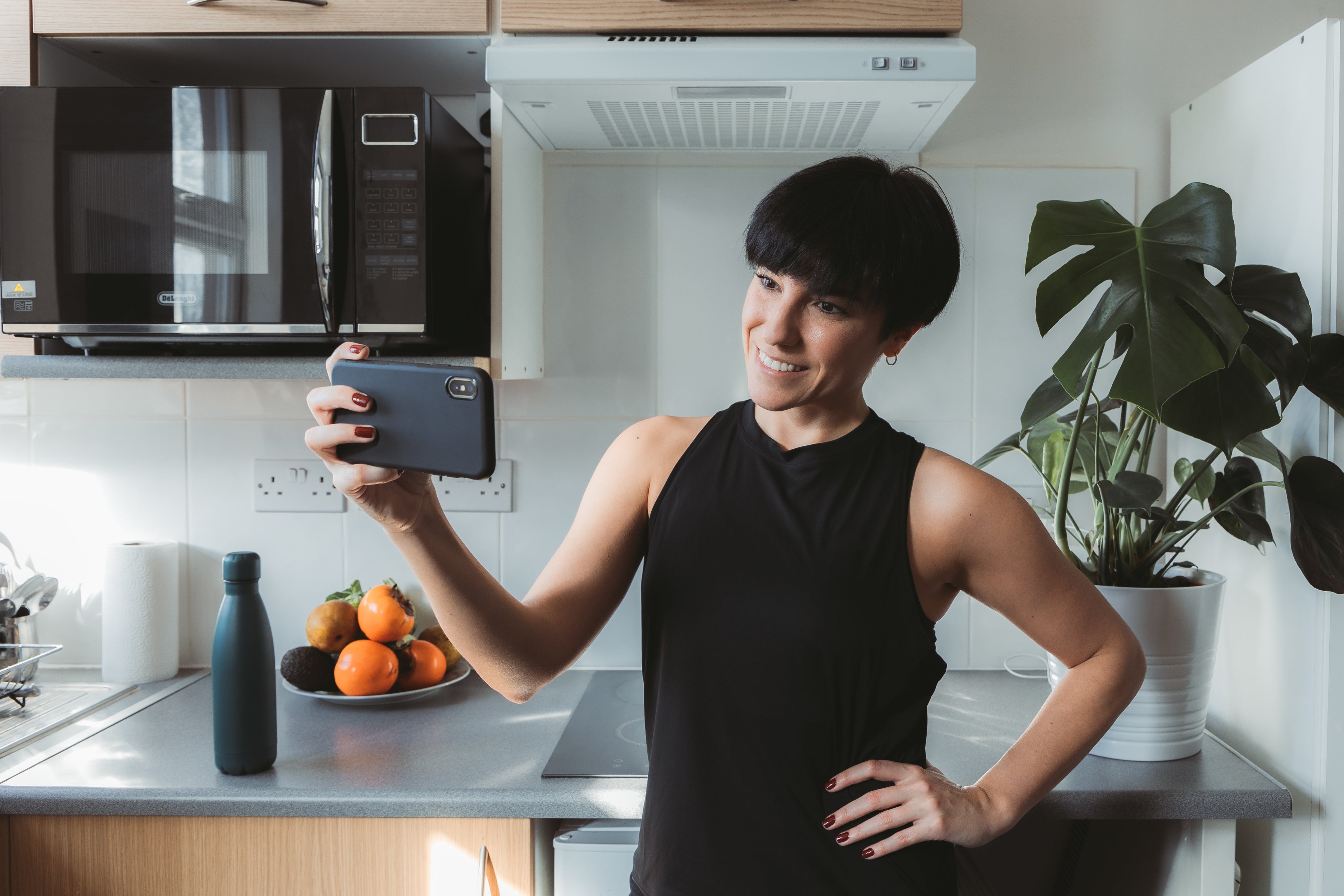 files/woman-holds-her-cellphone-horizontally-to-take-a-selfie.jpg